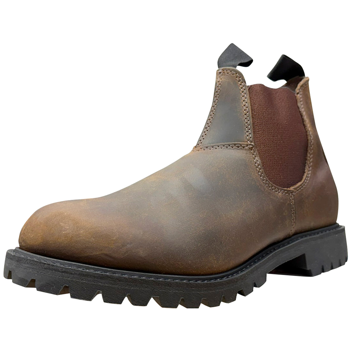A single brown leather Chelsea boot with a distressed finish, featuring dark brown elastic side panels and a black lug sole, shown against a plain white background.