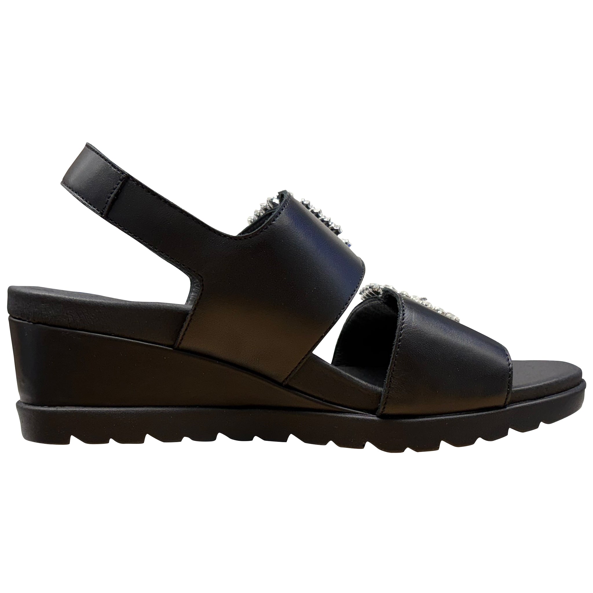 Black sandal with embellishments on a white background