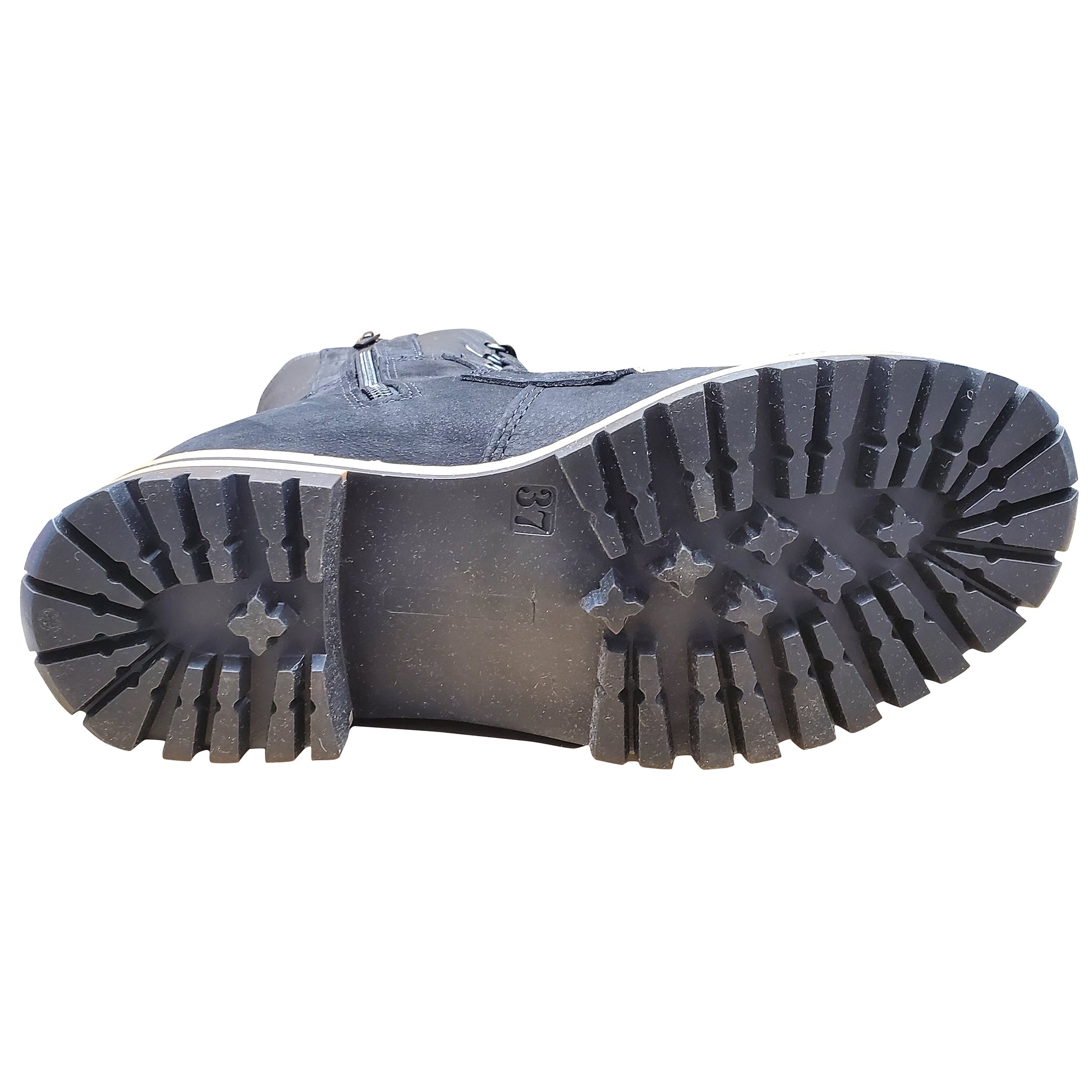 Close-up of a boot sole with tread pattern on a white background