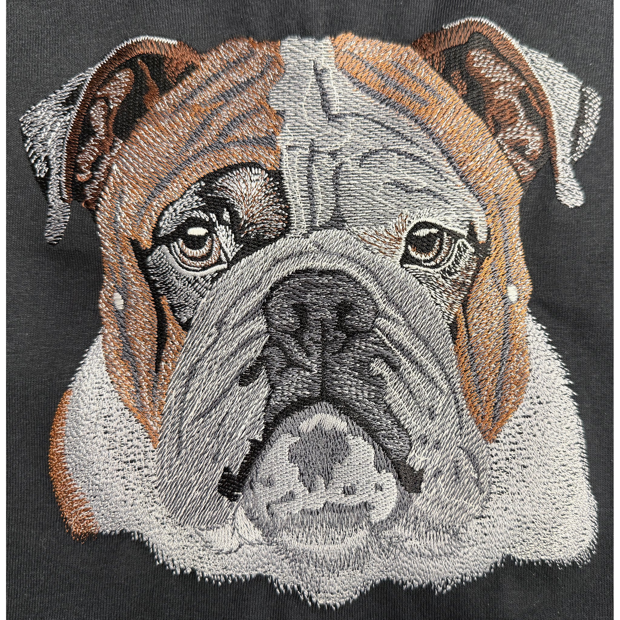 Embroidered bulldog face design on a black background