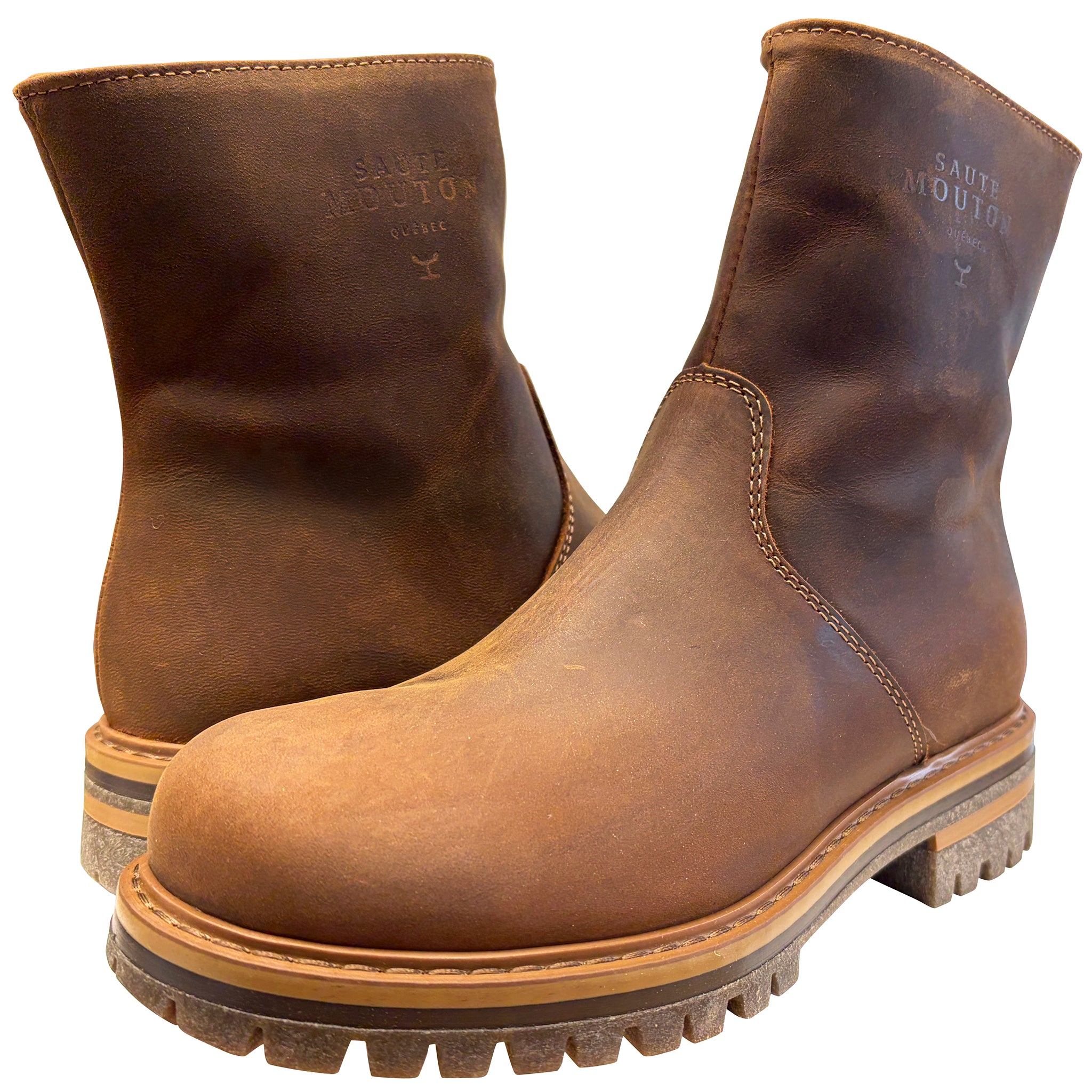 Pair of brown leather boots with visible brand name on a white background