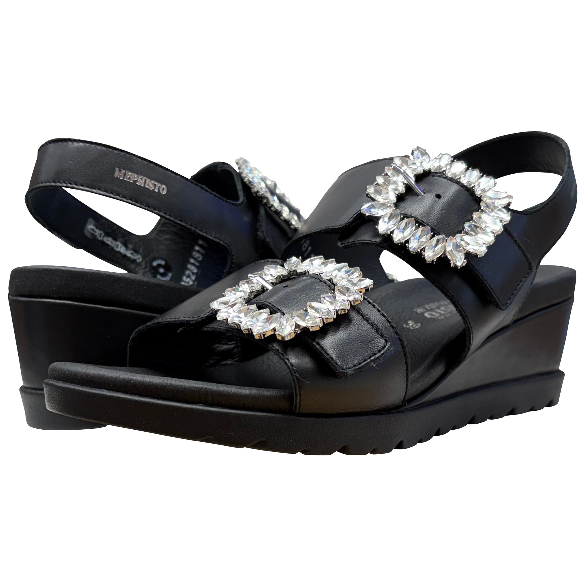 Black wedge sandals with crystal buckles on a white background