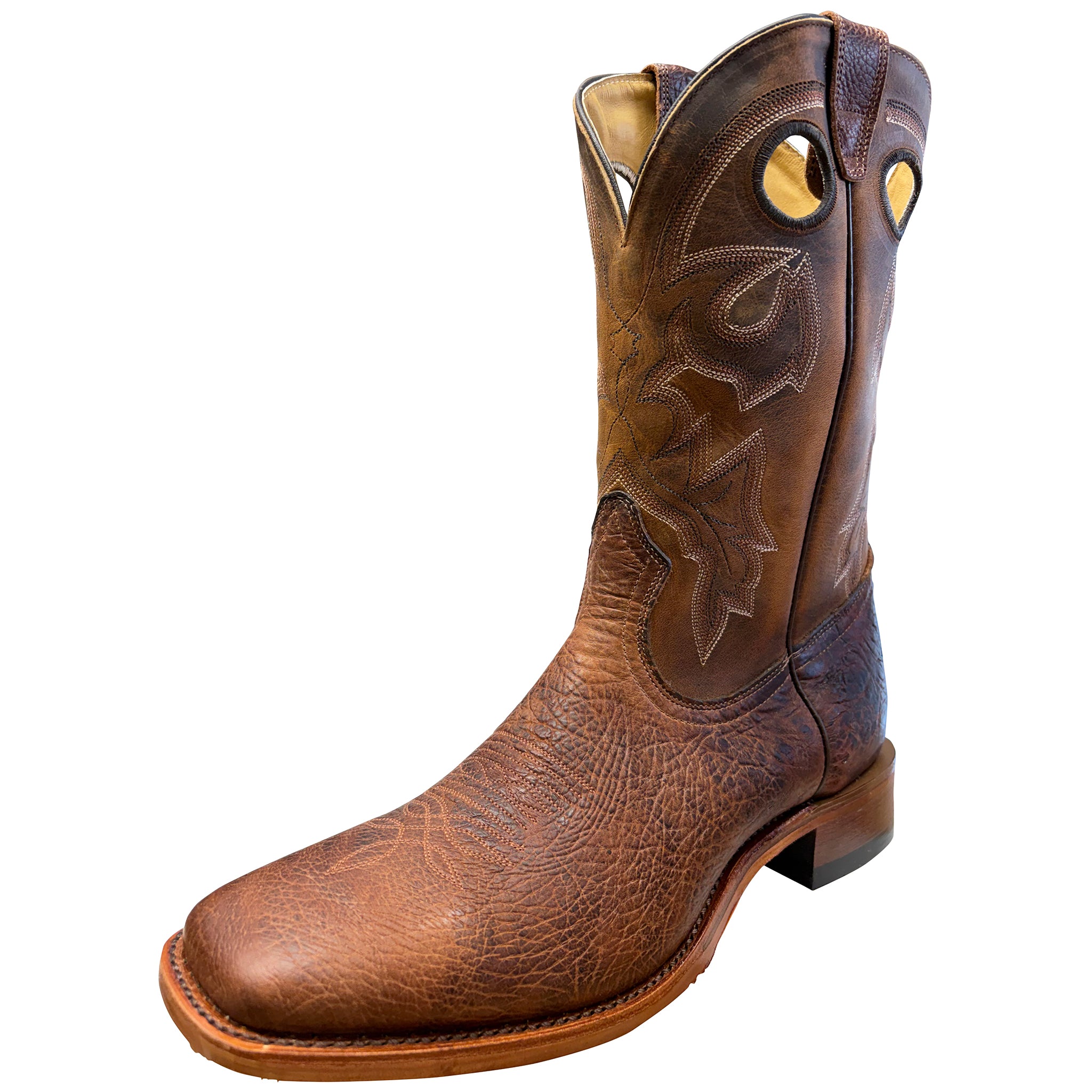 Brown leather cowboy boot with intricate stitching on a white background