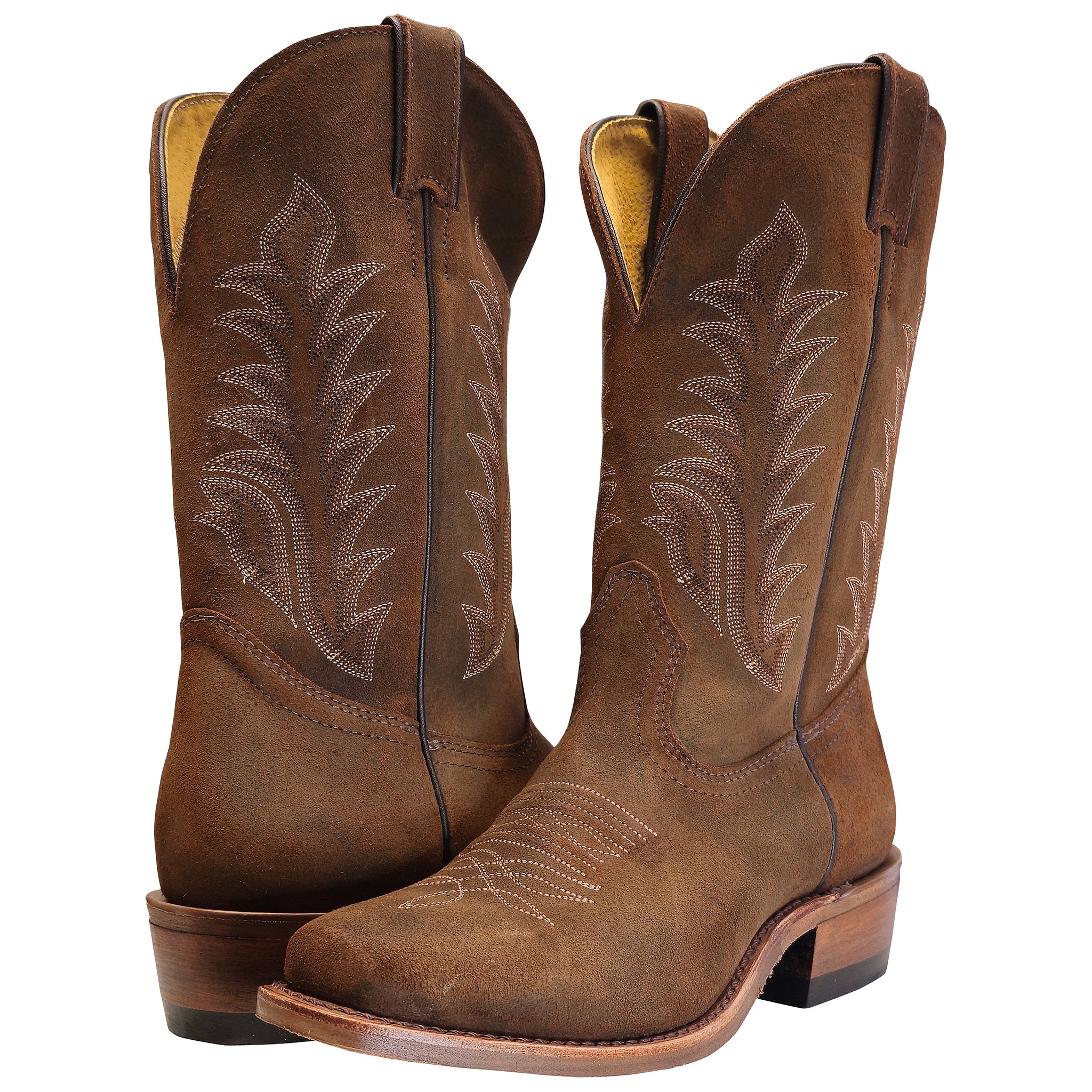 Pair of brown cowboy boots with intricate stitching on a white background