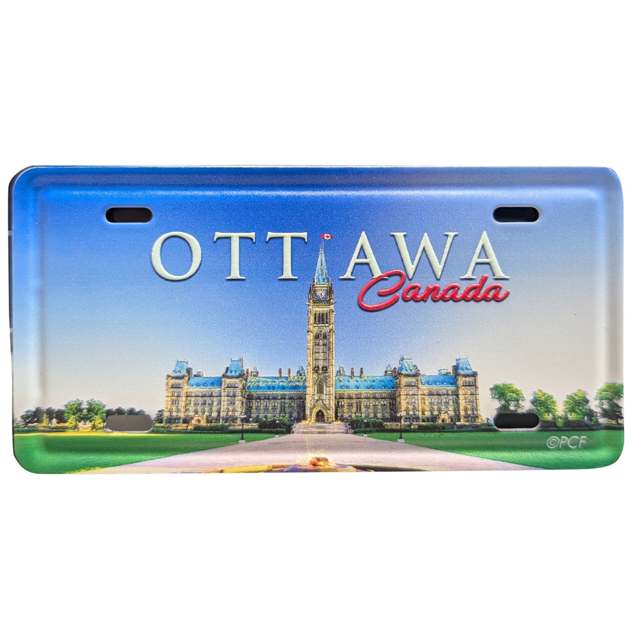 A novelty license plate featuring a printed scenic design of the Ottawa Parliament Building and the words 'OTTAWA Canada' on a blue gradient background.