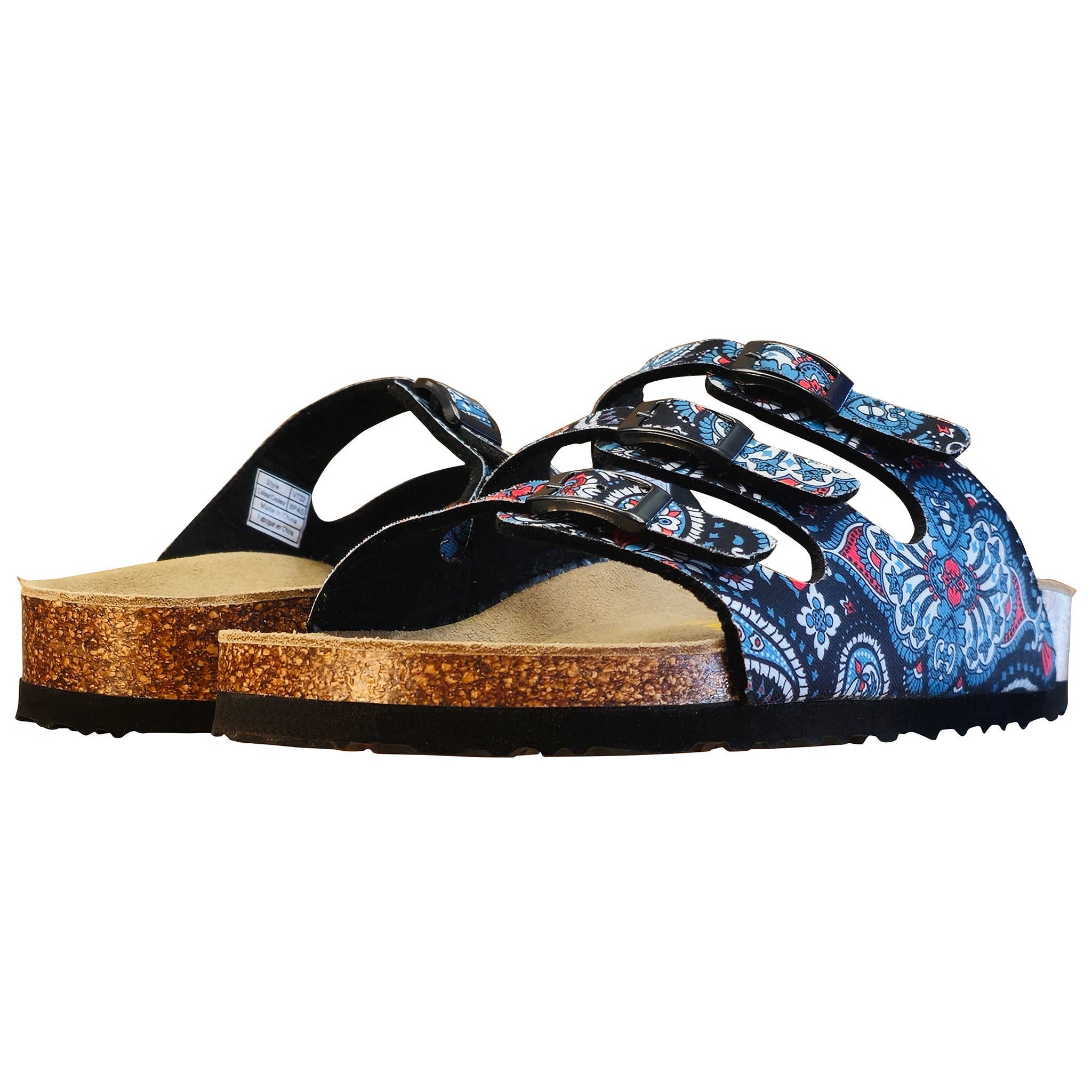 A pair of slide sandals with black straps, a blue and red paisley pattern on the sides, and cork-look soles, shown against a plain white background.