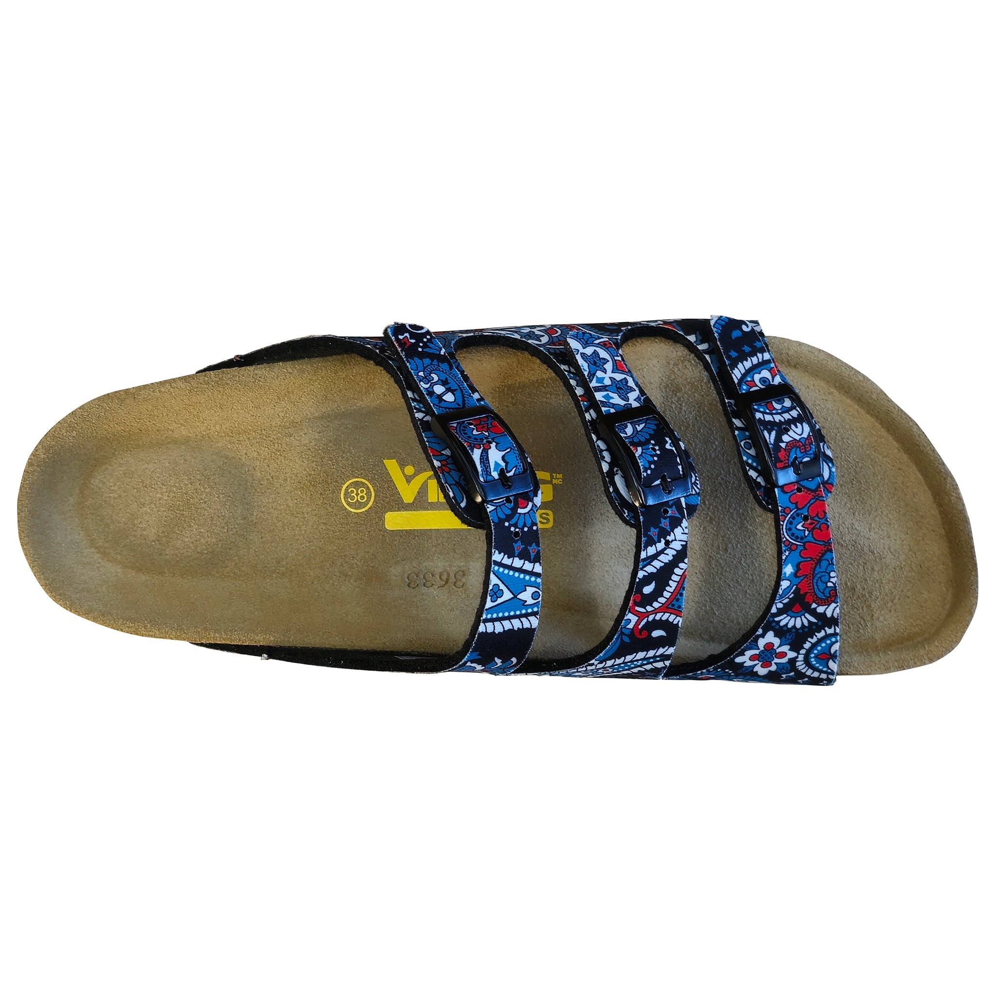 A single slide sandal shown from a top-down view on a white background. The sandal features a tan footbed with a yellow logo and three adjustable straps decorated with a blue, red, and white geometric pattern.